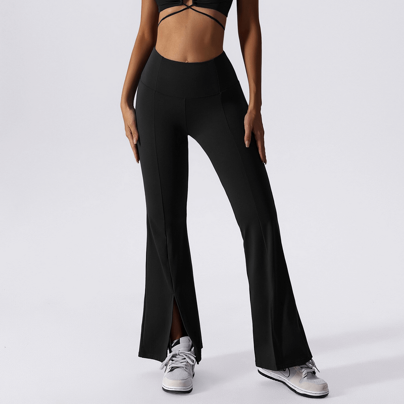 Woman wearing black wide-leg high waist yoga pants, perfect for fitness and movement.
